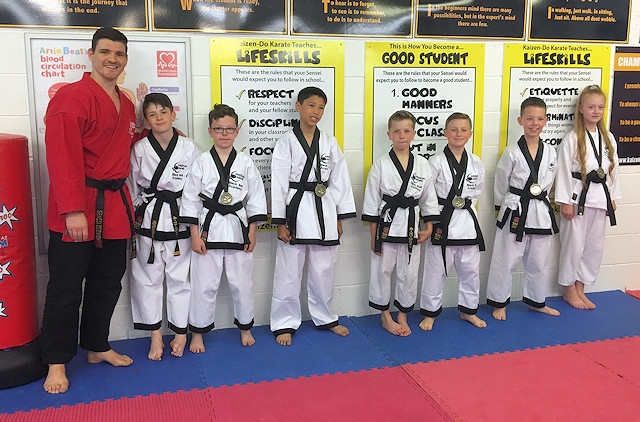 The latest students to be awarded their black belts at Kaizen-Do
