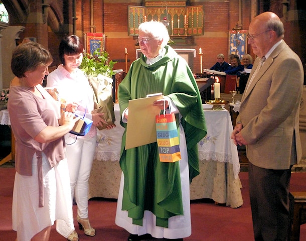 Church wardens Christine Longhurst (left) and Janice Perkins present the Rev Michael Howarth with retirement gifts from the congregation, accompanied by Peter Shrigley, a church officer