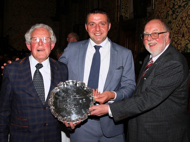 Last year's winner John Kay (right) presents the Man of Rochdale award to Ray Smith  (left) and Paul Ellison (centre)