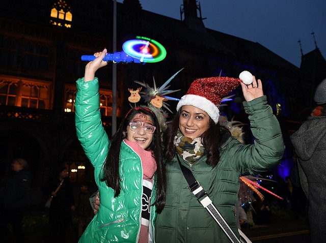 Guests at the Christmas lights switch on at Rochdale Town Hall get into the festive spirit