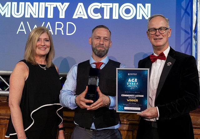 John Doyle collected the Community Action Award, presented by Lorraine Smith from Civica.