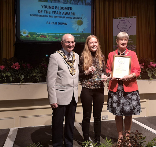 The Mayor of Rochdale, Councillor Billy Sheerin, congratulates Sarah Down (centre) on her award 