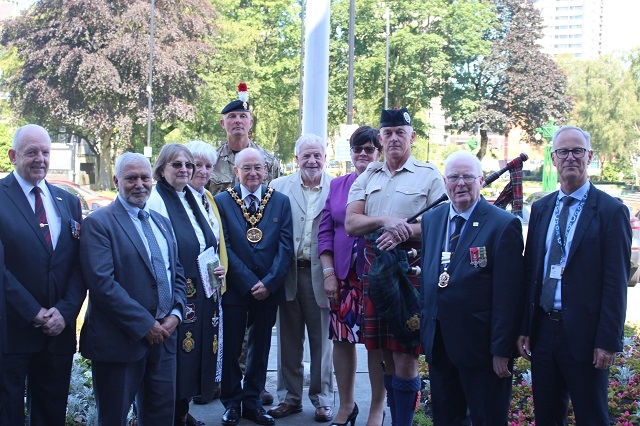 Mayor and Mayoress Billy and Lynn Sheerin, Councillors, veterans, Rev. Margaret Smith, Rochdale's town centre chaplain, and Steve Rumbelow (r), chief executive of Rochdale Borough Council, at Rochdale's flag raising event