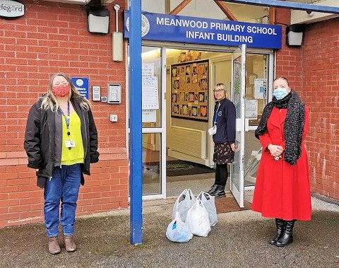 Donated uniform items being dropped off at Meanwood Primary School