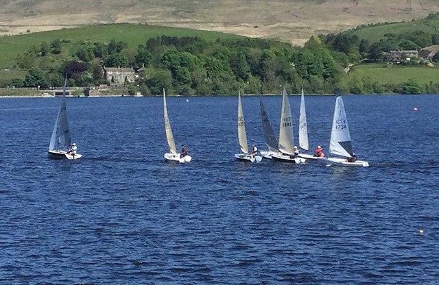 Boats line up for the start of a race