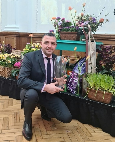 Paul Ellison with a Britain in Bloom award