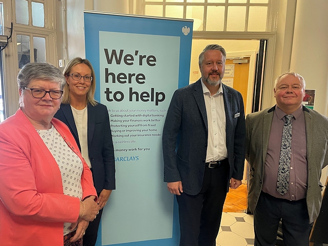 Council leader Councillor Neil Emmott and Councillor Janet Emsley, cabinet member for libraries, welcome the new service at Heywood Library with Barclays Bank staff