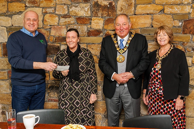 Chris Bell present Kirsty Rhodes from WHAG with a donation with Mike Holly and the Lady Mayoress