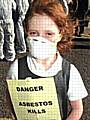 A young girl graphically highlights the danger of asbestos at a Save Spodden Valley protest