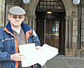 Middleton resident Peter Plumb outside Rochdale Town Hall with his eviction notices.