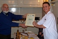 Calum Lill receives his award from John Pedley from the Rotary Club of Middleton. 