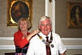 Outgoing president Janice Powell handing over the Rotary chain to John Brooker