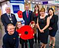 Poppy Hunt (front left) and Poppy Rigg both pupils at Bamford Academy joined Antony Cotton, Councillor McCarthy, David Forbes and council staff to launch the annual poppy appeal in Rochdale