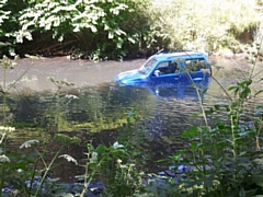Car abandoned in Heywood river