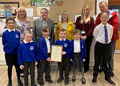 St Luke’s CE Primary School students, Head Teacher Kim Farrell with members of staff with Ellen Yates, Chair of Heywood in Bloom, and Councillor Peter Rush, Chair of Heywood Township