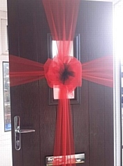 Claire Rea created and fit 62 of the special red cross and poppy door bows