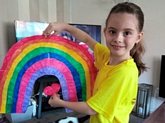 Lily-Rose Davies with the rainbow she drew to display at North Manchester General Hospital