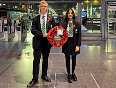 Oulder Hill's head boy Alfie Wild and head girl Imaan Mahmood at Manchester Piccadilly on their way to the Cenotaph in London