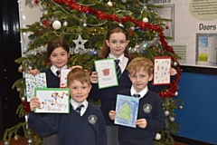 Children from St James' CofE, Wardle, with their Christmas cards