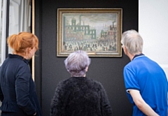 Locals were invited to view the Lowry paintings and learn more about the artwork from Touchstones staff