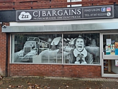 The Christmas-themed window at CJ Bargains, Milnrow shopping precinct