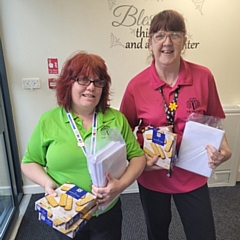 Staff at The Willows accept their donation and cards on behalf of the residents