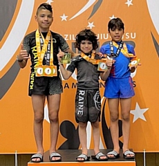L-R: Andrew, Ethan and Collin Perez with their gold medals