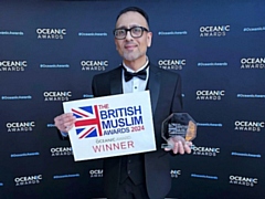 Asad Shamim with his award at the ceremony in Manchester
