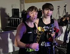 Isaac and Louie with trophy's after their bout
