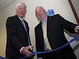 Rochdale MP Paul Rowen cuts the ribbon with Stuart Sawle