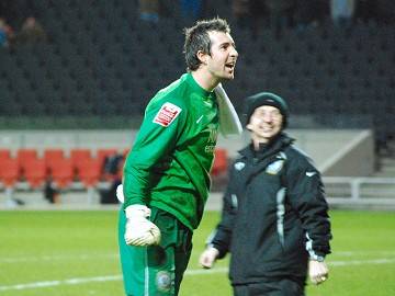 Russell can't hide his delight after a successful day between the sticks
