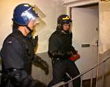 Police break down door on drugs raid