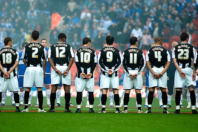 Rochdale players line up before the game