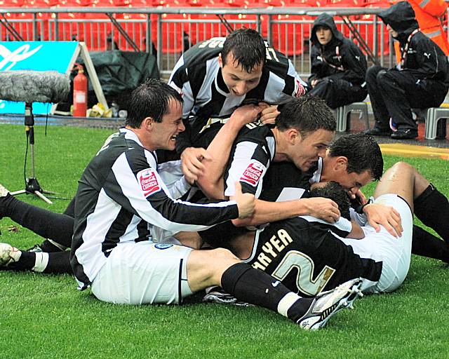 Players celebrate McArdle's goal