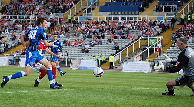 Warrington keeps out Buckley in the build-up to Dale's opening goal.