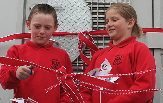 Edenfield Primary School children cut the ribbon to officially open Scout Moor Wind Farm.