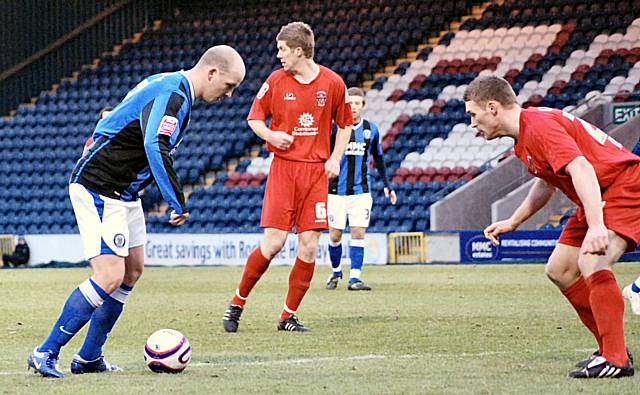 Lee McEvilly takes on an Accrington defender.