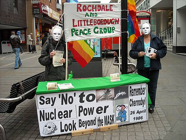 Peace Group members, Mai Chatham and Pat Sanchez wearing masks at the stall on Yorkshire Street on Saturday (25 April).