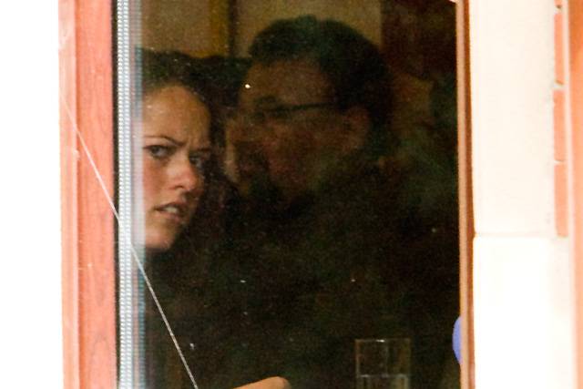 Karen Burke peers out of the window of the Broadfield Hotel during the Labour Party disciplinary hearing