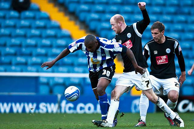 Sheffield Wednesday 2 - 0 Rochdale<br />Jason Kennedy tussles with Clinton Morrison