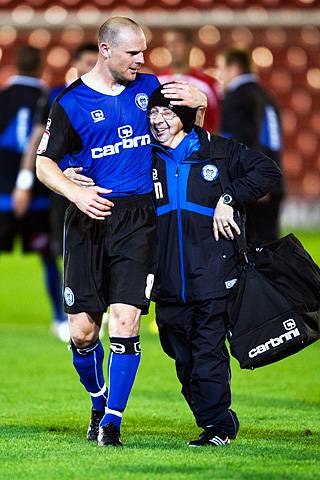 Barnsley 0 - 1 Rochdale<br />
Gary Jones and Jack Northover, the kit man, share a celebratory hug after the final whistle