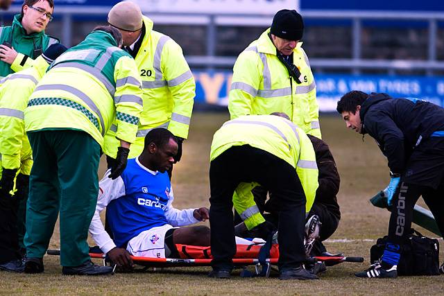 Oldham 1-2 Rochdale<br \> Oldham defender Jean-Yves M’Voto is stretchered off after landing awkwardly