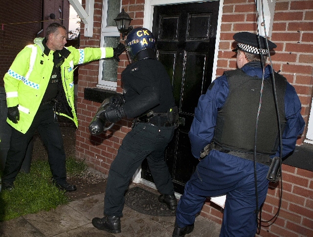 Police raids as part of investigation into burglaries (stock photo)