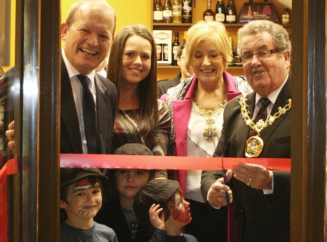 Simon and Karen Danczuk and family watch as Mayor Peter Rush cuts the ribbon to officially open Danczuk’s Deli 