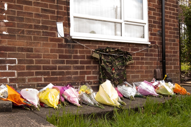 Floral tributes left in the garden of the Rigby family's home on the Langley estate