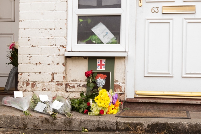 Floral tributes left in the garden of the Rigby family's home on the Langley estate