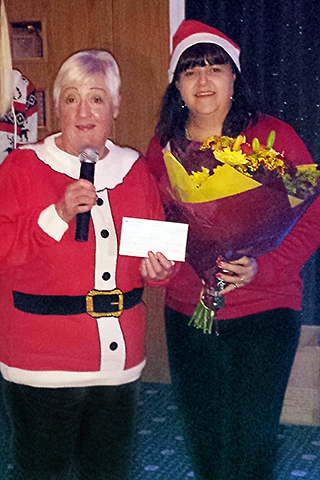 Carol Wardle, ex-Mayor of Rochdale, presents a cheque to the Foster Carer's Forum