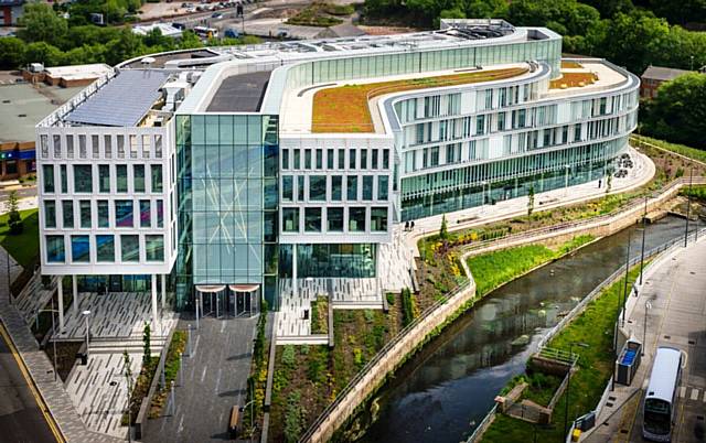 Councils across England will be able to hold public meetings using video or telephone conferencing during the coronavirus pandemic (pictured: Rochdale's council offices, Number One Riverside)