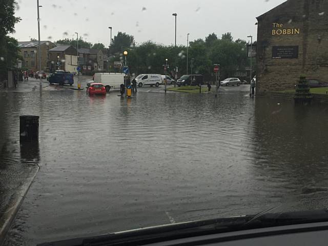 Milnrow village blocked of with severe flooding at the bottom of Kiln Lane