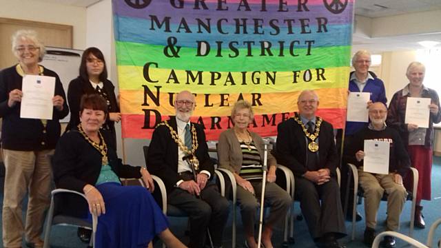 Rae Street from Rochdale and Littleborough Peace Group (standing), Elaine Dutton Mayoress of Rochdale (sitting), Councillor Derek Heffernan Mayor of Oldham (sitting), Di Heffernan Mayoress of Oldham (sitting), Councillor Ray Dutton Mayor of Rochdale (sitting), Philip Gilligan Chair of Greater Manchester and District Campaign for Nuclear Disarmament (standing), Steve Roman from Manchester Campaign for Nuclear Disarmament (sitting) and Linda Walker from Glossop Peace Group